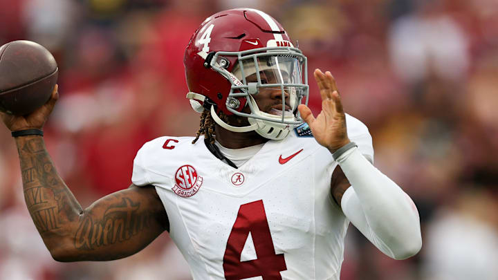 Dec 31, 2024; Tampa, FL, USA; Alabama Crimson Tide quarterback Jalen Milroe (4) drops back to pass against the Michigan Wolverines in the first quarter  during the ReliaQuest Bowl at Raymond James Stadium. Mandatory Credit: Nathan Ray Seebeck-Imagn Images