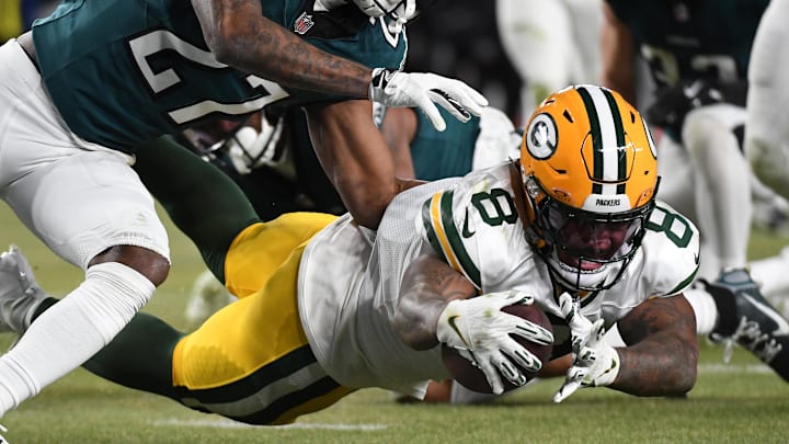 Green Bay Packers running back Josh Jacobs (8) dives for the end zone Philadelphia Eagles cornerback Quinyon Mitchell.