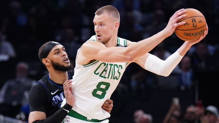 Jun 6, 2024; Boston, Massachusetts, USA; Boston Celtics center Kristaps Porzingis (8) controls the ball against Dallas Mavericks center Daniel Gafford (21) in the first quarter during game one of the 2024 NBA Finals at TD Garden. Mandatory Credit: David Butler II-USA TODAY Sports