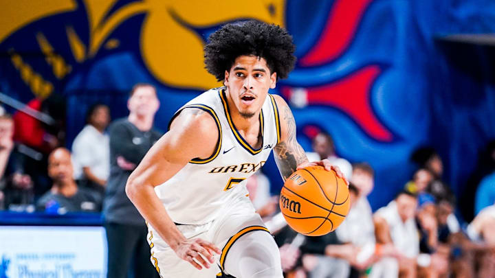 Drexel Dragons guard Kobe MaGee (5) handles the ball against Hamtpon