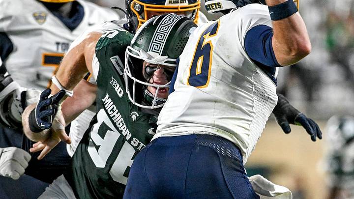 Michigan State’s Eli Coenen, left, pressures Toledo’s John Alan Richter during the third quarter on Friday, Sept. 4, 2026, at Spartan Stadium in East Lansing.