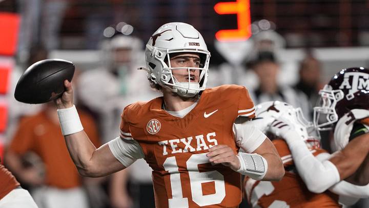 Texas Longhorns quarterback Arch Manning throws a pass during the first half against the Texas A&M Aggies. Texas Longhorns quarterback Arch Manning throws a pass during the first half against the Texas A&M Aggies.