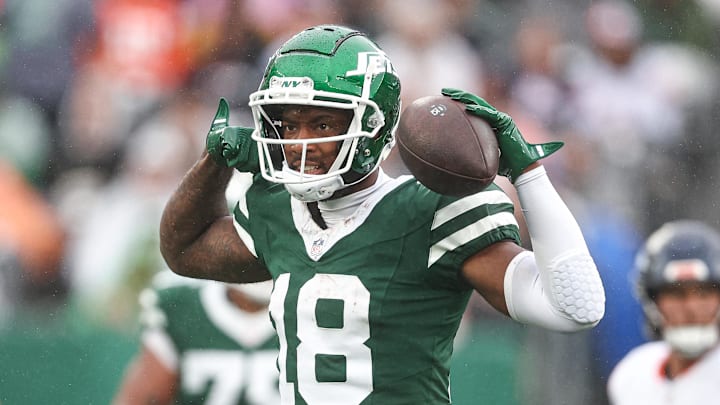 Sep 29, 2024; East Rutherford, New Jersey, USA; New York Jets wide receiver Mike Williams (18) celebrates a first down reception during the second half against the Denver Broncos at MetLife Stadium. Mandatory Credit: Vincent Carchietta-Imagn Images