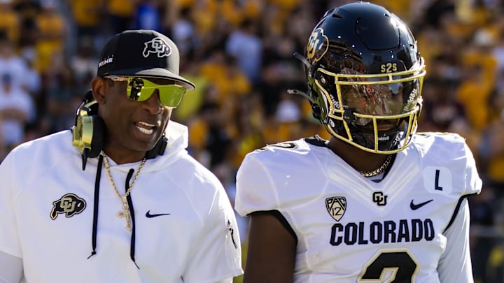 Oct 7, 2023; Tempe, Arizona, USA; Colorado Buffaloes head coach Deion Sanders with son and quarterback Shedeur Sanders (2) against the Arizona State Sun Devils at Mountain America Stadium. Mandatory Credit: Mark J. Rebilas-Imagn Images Oct 7, 2023; Tempe, Arizona, USA; Colorado Buffaloes head coach Deion Sanders with son and quarterback Shedeur Sanders (2) against the Arizona State Sun Devils at Mountain America Stadium. Mandatory Credit: Mark J. Rebilas-Imagn Images