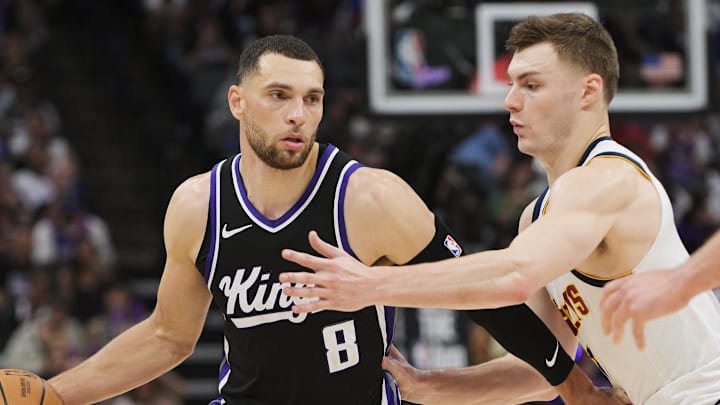 Apr 9, 2025; Sacramento, California, USA; Sacramento Kings guard Zach LaVine (8) controls the ball against Denver Nuggets guard Christian Braun (0) during the third quarter at Golden 1 Center. Apr 9, 2025; Sacramento, California, USA; Sacramento Kings guard Zach LaVine (8) controls the ball against Denver Nuggets guard Christian Braun (0) during the third quarter at Golden 1 Center.