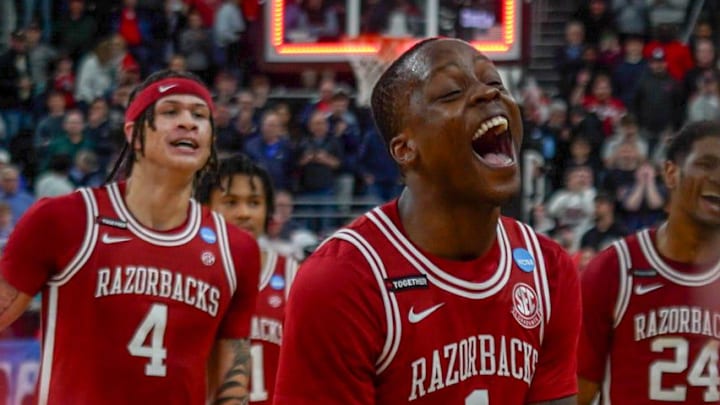 Arkansas Razorbacks guard Johnell Davis and forward Trevon Brazile celebrate with their team as they advance to the NCAA Tournament's Sweet Sixteen round for the fourth time in five seasons. 