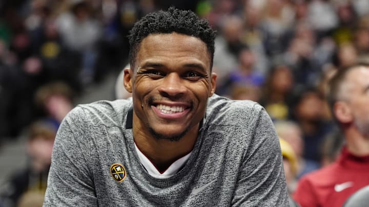 Dec 28, 2024; Denver, Colorado, USA; Denver Nuggets guard Russell Westbrook (4) reacts from the bench in the second half against the Detroit Pistons at Ball Arena. Mandatory Credit: Ron Chenoy-Imagn Images