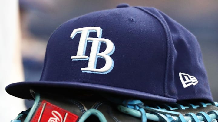 Sep 6, 2019; St. Petersburg, FL, USA; A detail view of a Tampa Bay Rays hat and glove at Tropicana Field.
