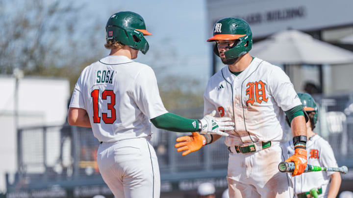 Miami Hurricanes catcher Alex Sosa (13) and right fielder Derek Williams (2) against Lafayette 