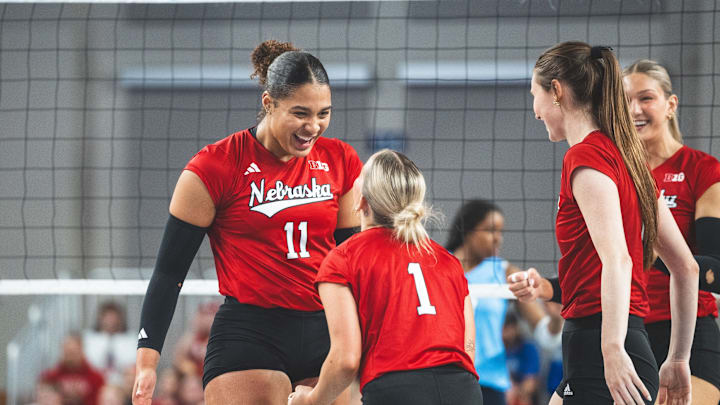 Teraya Sigler celebrates with her teammates after a point against Creighton. The sophomore outside hitter led NU with 11 kills on a .647 hitting percentage. 