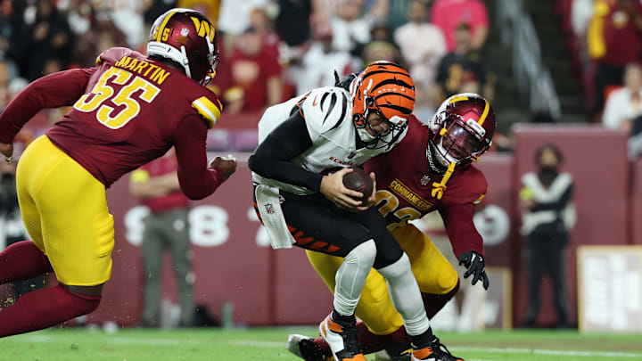 Aug 18, 2025; Landover, Maryland, USA; Cincinnati Bengals quarterback Joe Burrow (9) is sacked by Washington Commanders defensive end Dorance Armstrong (92) and Washington Commanders defensive end Jacob Martin (55) during the first half at Northwest Stadium. Mandatory Credit: Amber Searls-Imagn Images Aug 18, 2025; Landover, Maryland, USA; Cincinnati Bengals quarterback Joe Burrow (9) is sacked by Washington Commanders defensive end Dorance Armstrong (92) and Washington Commanders defensive end Jacob Martin (55) during the first half at Northwest Stadium. Mandatory Credit: Amber Searls-Imagn Images