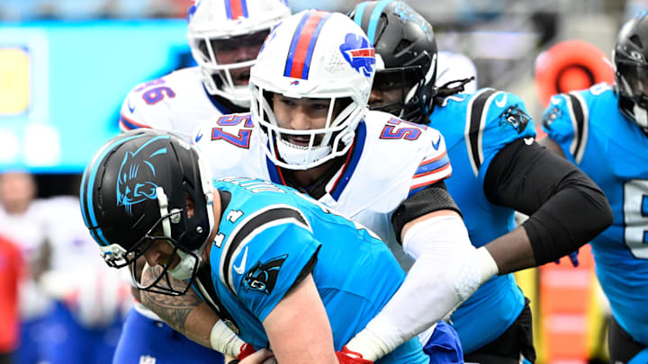 Oct 26, 2025; Charlotte, North Carolina, USA;  Carolina Panthers quarterback Andy Dalton (14) is sacked by Buffalo Bills defensive end AJ Epenesa (57) in the fourth quarter at Bank of America Stadium. Mandatory Credit: Bob Donnan-Imagn Images