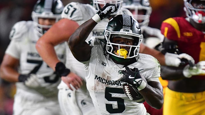 Sep 20, 2025; Los Angeles, California, USA; Michigan State Spartans running back Makhi Frazier (5) runs the ball against the Southern California Trojans during the second half at the Los Angeles Memorial Coliseum. Mandatory Credit: Gary A. Vasquez-Imagn Images