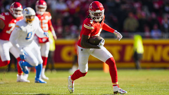 Dec 14, 2025; Kansas City, Missouri, USA; Kansas City Chiefs wide receiver Rashee Rice (4) runs for yards after the catch against the Los Angeles Chargers during the first quarter at GEHA Field at Arrowhead Stadium. Mandatory Credit: Jay Biggerstaff-Imagn Images