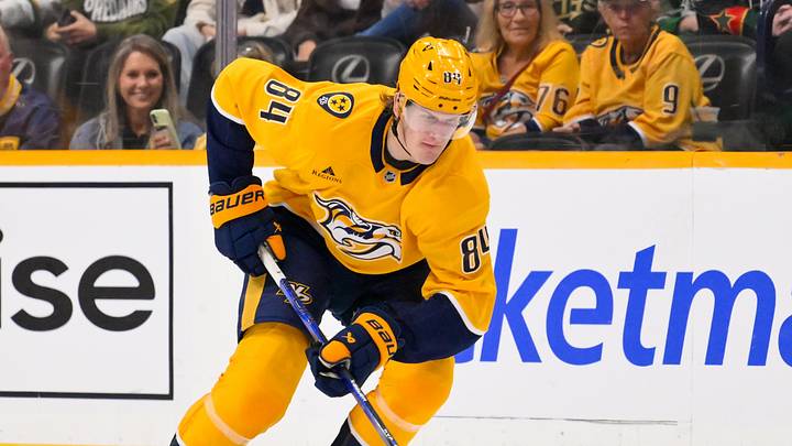 Oct 3, 2026; Nashville, Tennessee, USA;  Nashville Predators center Adam Edstrom (84) skates with the puck Dallas Stars during the first period at Bridgestone Arena. Mandatory Credit: Steve Roberts-Imagn Images