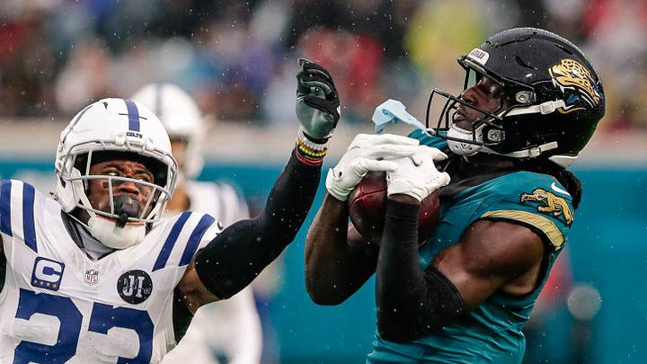 Dec 7, 2025; Jacksonville, Florida, USA;Jacksonville Jaguars wide receiver Brian Thomas Jr. (7) catches a pass over Indianapolis Colts cornerback Kenny Moore II (23) at EverBank Stadium. 