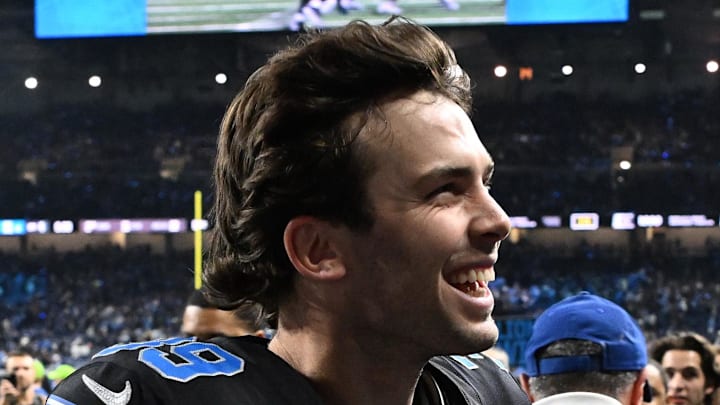 Detroit Lions kicker Jake Bates (39) celebrates with fans as he runs off the field following the Lions win over the Vikings