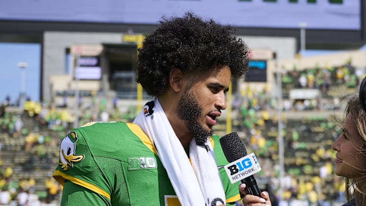 Aug 30, 2025; Eugene, Oregon, USA; Oregon Ducks quarterback Dante Moore (5) talks to the media after a game against the Montana State Bobcats at Autzen Stadium. Mandatory Credit: Troy Wayrynen-Imagn Images