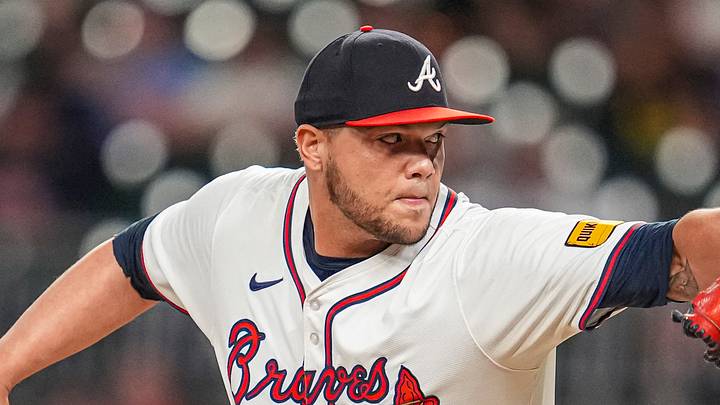 Sep 4, 2024; Cumberland, Georgia, USA; Atlanta Braves pitcher Joe Jimenez (77) pitches against the Colorado Rockies during the eighth inning at Truist Park. Mandatory Credit: Dale Zanine-Imagn Images
