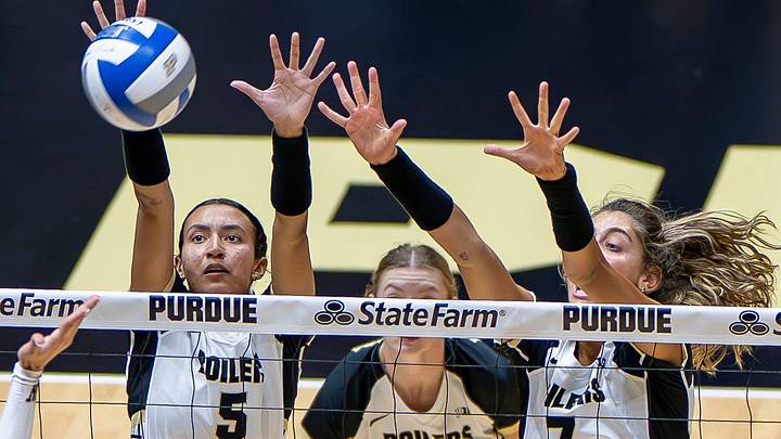 Purdue volleyball players Taylor Anderson and Bianka Lulic go for a block. Purdue volleyball players Taylor Anderson and Bianka Lulic go for a block.