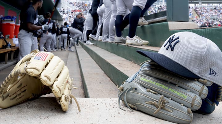 Feb 25, 2025; Fort Myers, Florida, USA; Detail view of gloves and a hat in the New York Yankees dugout during the game against the Minnesota Twins at Lee Health Sports Complex. Mandatory Credit: Chris Tilley-Imagn Images Feb 25, 2025; Fort Myers, Florida, USA; Detail view of gloves and a hat in the New York Yankees dugout during the game against the Minnesota Twins at Lee Health Sports Complex. Mandatory Credit: Chris Tilley-Imagn Images