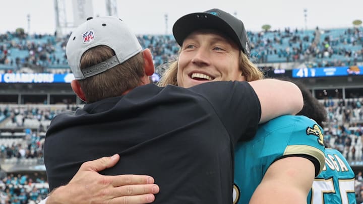 Jan 4, 2026; Jacksonville, Florida, USA; Jacksonville Jaguars quarterback Trevor Lawrence (16) celebrates with head coach Liam Coen (obscured) after the game against the Tennessee Titans at EverBank Stadium. 