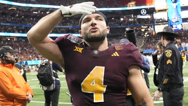 Arizona State running back Cam Skattebo (4) blows a kiss toward fans after Texas won 39-31 in double overtime in the Chick-fil-A Peach Bowl in Atlanta on Jan. 1, 2025. Arizona State running back Cam Skattebo (4) blows a kiss toward fans after Texas won 39-31 in double overtime in the Chick-fil-A Peach Bowl in Atlanta on Jan. 1, 2025.