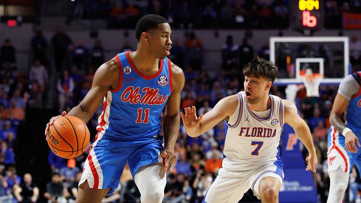 Mar 8, 2025; Gainesville, Florida, USA; Mississippi Rebels guard Matthew Murrell (11) drives to the basket while Florida Gators guard Urban Klavzar (7) defends during the first half at Exactech Arena at the Stephen C. O'Connell Center. Mandatory Credit: Matt Pendleton-Imagn Images