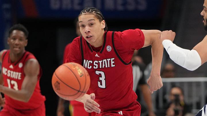 Mar 12, 2026; Charlotte, NC, USA; NC State Wolfpack guard Matt Able (3) and Virginia Cavaliers forward Devin Tillis (11) fight for the ball in the first half at Spectrum Center. Mandatory Credit: Bob Donnan-Imagn Images