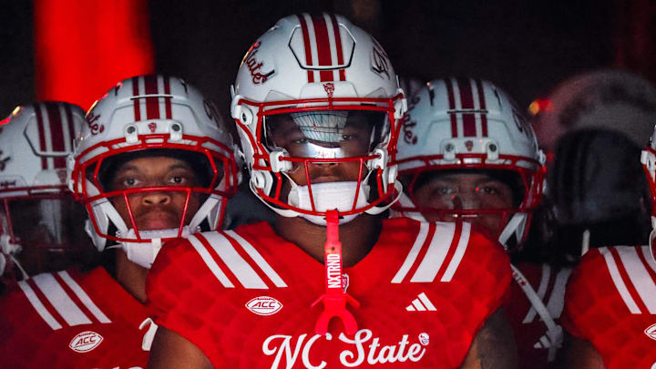 Aug 28, 2025; Raleigh, North Carolina, USA; North Carolina State Wolfpack tight end Justin Joly (7) looks on during the warmups prior to the game against East Carolina Pirates at Carter-Finley Stadium. Mandatory Credit: Jaylynn Nash-Imagn Images