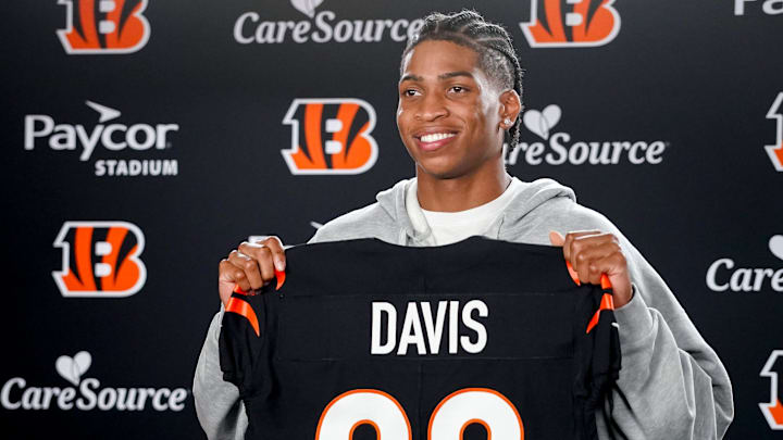 Cincinnati Bengals third round pick Tacario Davis holds his jersey at a press conference during the 2026 NFL Draft, Saturday, April 25, 2026, at Paycor Stadium in downtown Cincinnati.