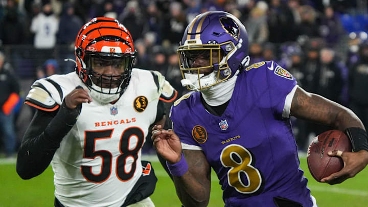 Bengals Joseph Ossai (58) rushes Ravens Lamar Jackson (8) during their game at M&T Bank Stadium on Thanksgiving Thursday November 27, 2025. The Bengals won the game with a final score of 33-14.