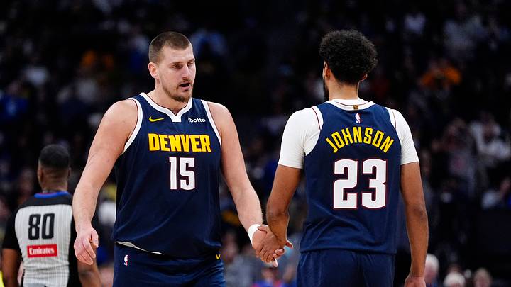 Dec 15, 2025; Denver, Colorado, USA; Denver Nuggets forward Cameron Johnson (23) and center Nikola Jokic (15) in the second quarter against the Houston Rockets at Ball Arena. Mandatory Credit: Ron Chenoy-Imagn Images Dec 15, 2025; Denver, Colorado, USA; Denver Nuggets forward Cameron Johnson (23) and center Nikola Jokic (15) in the second quarter against the Houston Rockets at Ball Arena. Mandatory Credit: Ron Chenoy-Imagn Images