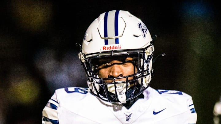 Farmington's Myles Smith celebrates a defensive stop during the Division 2 football district semifinal on Friday, Nov. 1, 2024.
