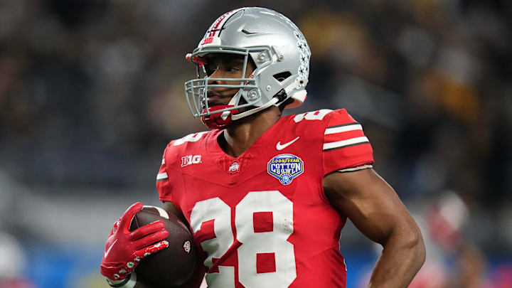 Dec 29, 2023; Arlington, Texas, USA; Ohio State Buckeyes running back TC Caffey (28) warms up prior to the Goodyear Cotton Bowl Classic against the Missouri Tigers at AT&T Stadium. Dec 29, 2023; Arlington, Texas, USA; Ohio State Buckeyes running back TC Caffey (28) warms up prior to the Goodyear Cotton Bowl Classic against the Missouri Tigers at AT&T Stadium.