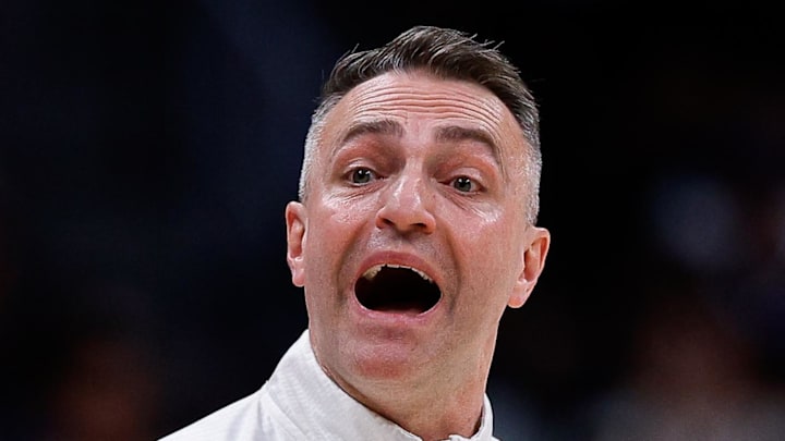 Toronto Raptors head coach Darko Rajakovic gestures in the third quarter against the Denver Nuggets.