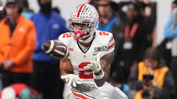 Jan 20, 2025; Atlanta, GA, USA; Ohio State Buckeyes wide receiver Emeka Egbuka (2) catches a pass against the Notre Dame Fighting Irish in the first half in the CFP National Championship college football game at Mercedes-Benz Stadium. Mandatory Credit: Dale Zanine-Imagn Images