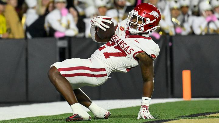Arkansas Razorbacks running back Cam Settles celebrates his touchdown against the Vanderbilt Commodores during the first half at FirstBank Stadium. Arkansas Razorbacks running back Cam Settles celebrates his touchdown against the Vanderbilt Commodores during the first half at FirstBank Stadium.