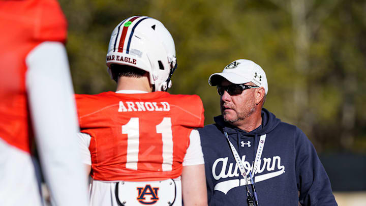 Auburn Tigers head coach Hugh Freeze works with new quarterback Jackson Arnold at spring practice. Auburn Tigers head coach Hugh Freeze works with new quarterback Jackson Arnold at spring practice.