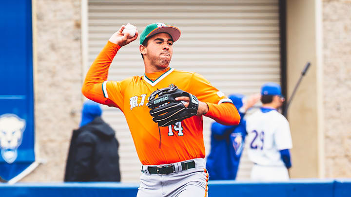 Miami Hurricanes third baseman Daniel Cuvet (14) against Pitt, throwing to first baseman Todd Hudson (18) Miami Hurricanes third baseman Daniel Cuvet (14) against Pitt, throwing to first baseman Todd Hudson (18)