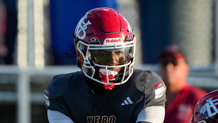 Vero Beach quarterback Champ Monds (1) passes the ball to running back Jonathan Hillsman (8) in a football game against Norland, Aug. 15, 2025, at the Citrus Bowl. Vero Beach quarterback Champ Monds (1) passes the ball to running back Jonathan Hillsman (8) in a football game against Norland, Aug. 15, 2025, at the Citrus Bowl.