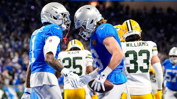 Detroit Lions wide receiver Isaac TeSlaa (18) celebrates a touchdown against Packers with Jameson Williams