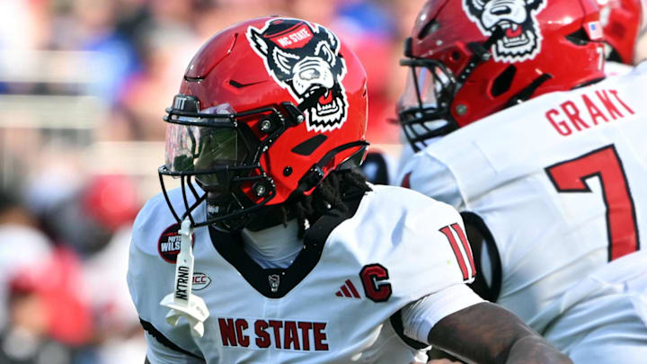 Sep 20, 2025; Durham, North Carolina, USA;  North Carolina State Wolfpack quarterback CJ Bailey (11) runs the ball against the Duke Blue Devils during the first quarter at Wallace Wade Stadium. Mandatory Credit: Zachary Taft-Imagn Images