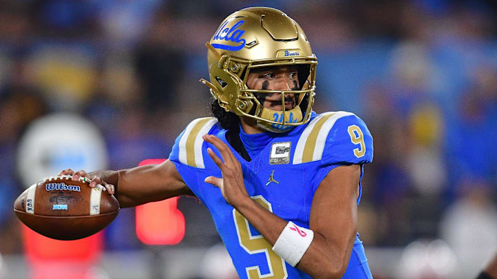 Nov 8, 2025; Pasadena, California, USA; UCLA Bruins quarterback Nico Iamaleava (9) throws against the Nebraska Cornhuskers during the first half at the Rose Bowl. Mandatory Credit: Gary A. Vasquez-Imagn Images