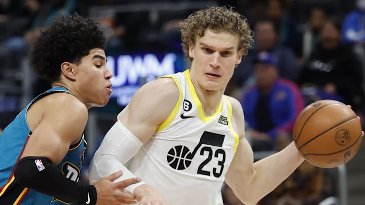 Dec 20, 2022; Detroit, Michigan, USA;  Utah Jazz forward Lauri Markkanen (23) dribbles defended by Detroit Pistons guard Killian Hayes (7) in the second half at Little Caesars Arena. Mandatory Credit: Rick Osentoski-Imagn Images