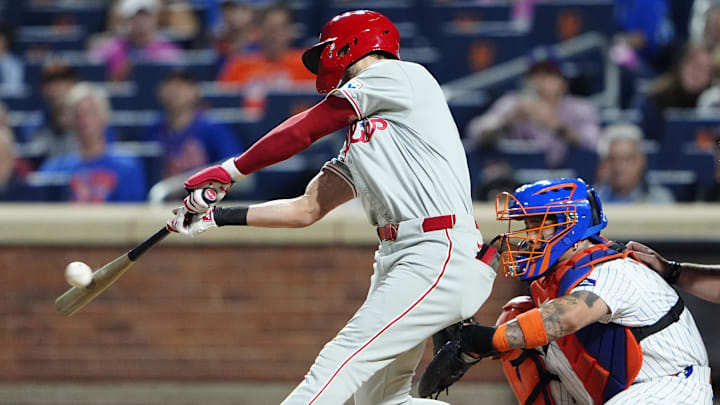 Sep 22, 2024; New York City, New York, USA;  Philadelphia Phillies shortstop Trea Turner (7) hits a single against the New York Mets during the first inning at Citi Field