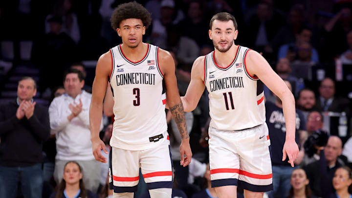 Mar 13, 2025; New York, NY, USA; Connecticut Huskies forward Jaylin Stewart (3) and forward Alex Karaban (11) during the second half against the Villanova Wildcats at Madison Square Garden. Mandatory Credit: Brad Penner-Imagn Images