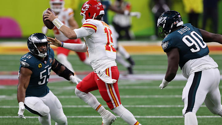 Feb 9, 2025; New Orleans, LA, USA; Kansas City Chiefs quarterback Patrick Mahomes (15) runs with the ball against Philadelphia Eagles defensive end Brandon Graham (55) and defensive tackle Jordan Davis (90) during the second half of Super Bowl LIX at Caesars Superdome. Mandatory Credit: Bill Streicher-Imagn Images