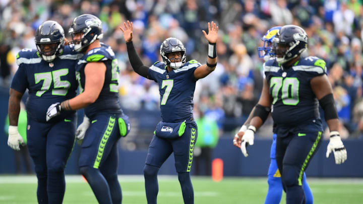 Nov 3, 2024; Seattle, Washington, USA; Seattle Seahawks quarterback Geno Smith (7) celebrates after throwing a touchdown pass against the Los Angeles Rams during the first half at Lumen Field. Mandatory Credit: Steven Bisig-Imagn Images