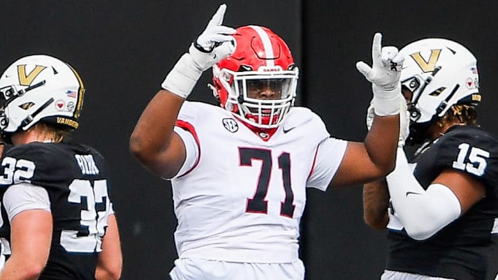 Oct 14, 2023; Nashville, Tennessee, USA;  Georgia Bulldogs offensive lineman Earnest Greene III (71) celebrates a touchdown scored by quarterback Carson Beck (15) against the Vanderbilt Commodores during the first half at FirstBank Stadium. Mandatory Credit: Steve Roberts-Imagn Images